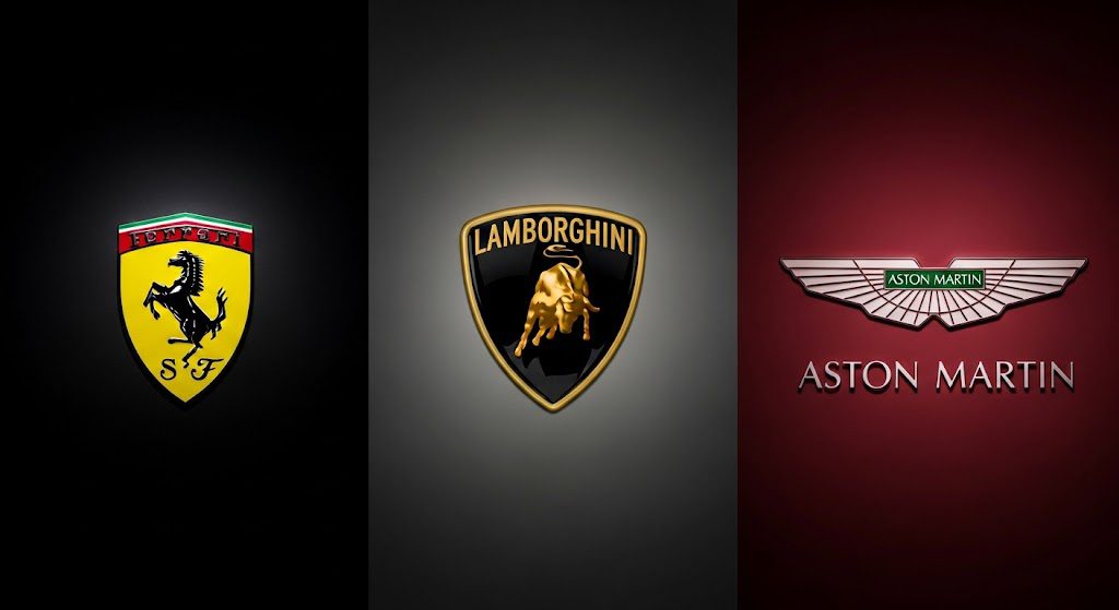 Lançamentos de carros de luxo 2025: Ferrari, Lamborghini e Aston Martin revelam supercarros Logotipos da Ferrari, Lamborghini e Aston Martin, representando os lançamentos de carros de luxo e supercarros em 2025.